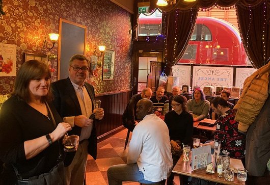 Marie O'Regan and Mike Smith announcing Absinthe Books titles in pub