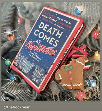photograph of a copy of Death Comes at Christmas, edited by Marie O'Regan and Paul Kane, on top of a green blanket, and beside treelights and a gingerbread man with the head bitten off