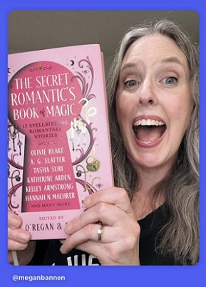 photograph of an open-mouthed Megan Bannen holding a copy of The Secret Romantic's Book of Magic, edited by Marie O'Regan and Paul Kane