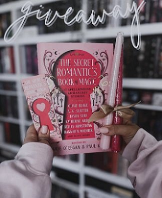screenshot showing a woman's hands holding a copy of The Secret Romantic's Book of Magic, edited by Marie O'Regan and Paul Kane, a Secret Romantic's bookmark, and two pink candles tied with gold ribbon, up against white bookshelves. Text at the top reads; GIVEAWAY