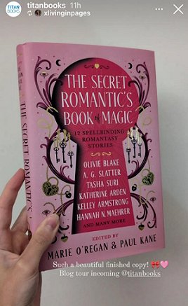 photograph of a woman's hand holding a copy of The Secret Romantic's Book of Magic, edited by Marie O'Regan and Paul Kane, up against a white background. Text reads; Such a beautiful finished copy! Blog tour incoming @titanbooks