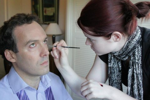 Robert being made up for a shot